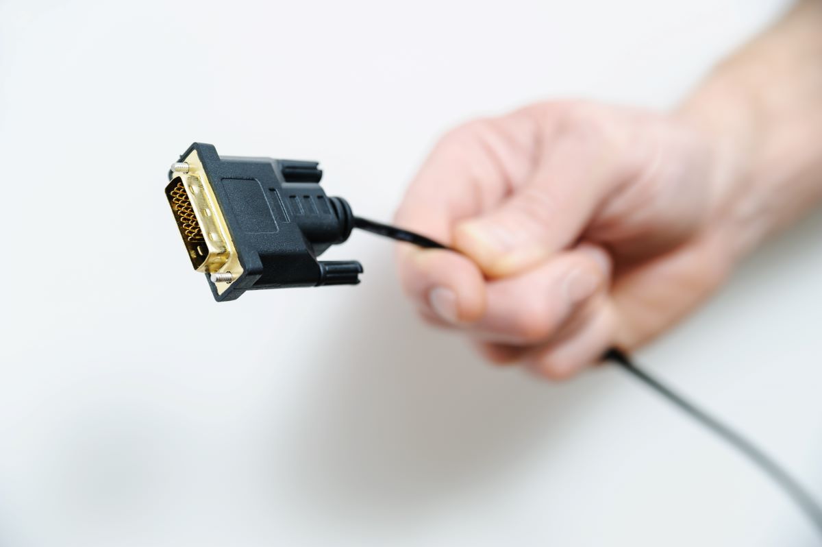 Man Holding Cable Plug