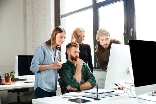 Team Looking At Computer